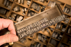 Setting type in a composing stick Composing stick